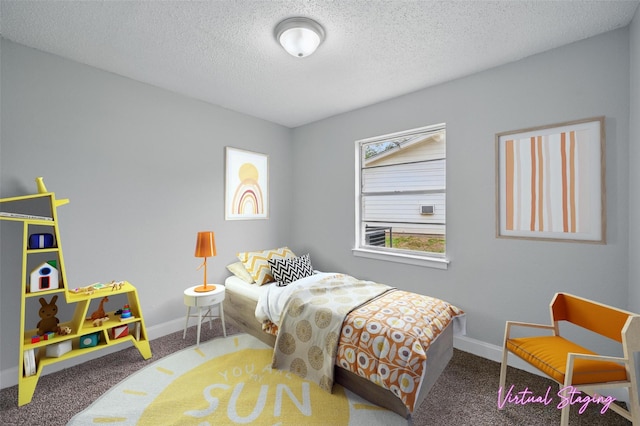 bedroom featuring a textured ceiling, baseboards, and carpet