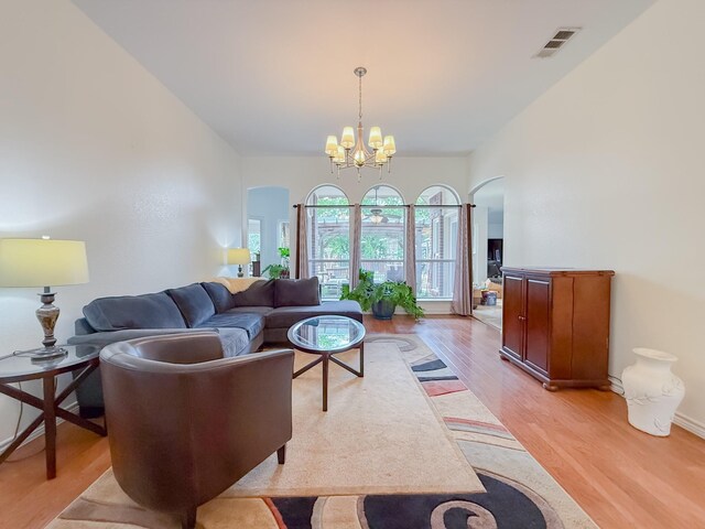 200 Meadowside Dr, Mansfield, TX 76063 - dining area featuring a chandelier, light wood-style flooring, and baseboards