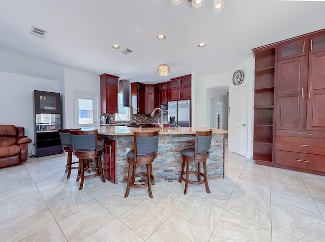 200 Meadowside Dr, Mansfield, TX 76063 - kitchen with stainless steel appliances, light marble finish floors, tasteful backsplash, a chandelier, and recessed lighting