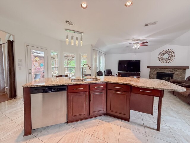 kitchen with a sink, dishwasher, a ceiling fan, open floor plan, and visible vents
