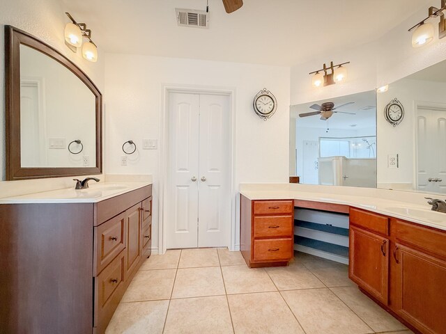full bath featuring a sink, tile patterned floors, a ceiling fan, and visible vents