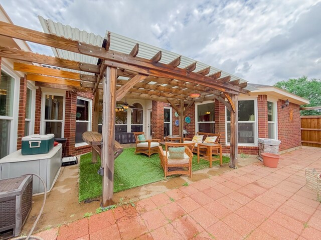 view of patio / terrace with an outdoor living space, fence, and a pergola