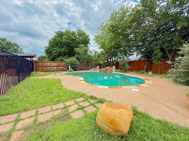 view of pool with a fenced backyard, a fenced in pool, and a patio area