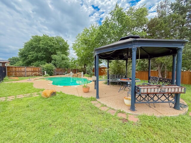 view of pool featuring a yard, a gazebo, a fenced in pool, and a fenced backyard