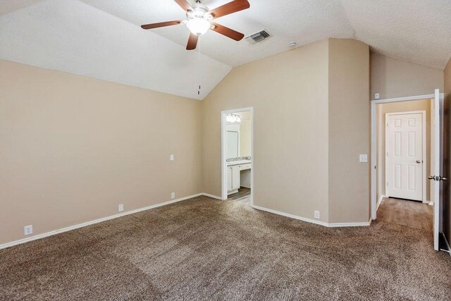 spare room with visible vents, a ceiling fan, carpet flooring, and lofted ceiling