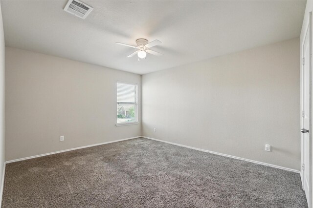 spare room with visible vents, carpet, ceiling fan, and baseboards