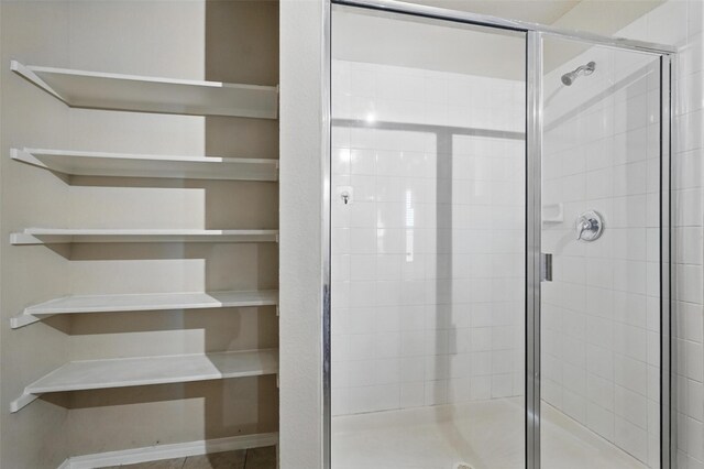 bathroom featuring a stall shower
