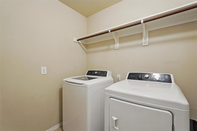 washroom featuring independent washer and dryer and laundry area