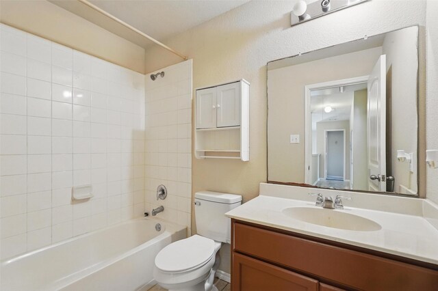 full bath with vanity, washtub / shower combination, and toilet