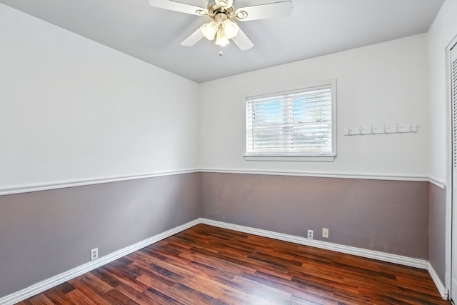 empty room with baseboards, ceiling fan, and wood finished floors