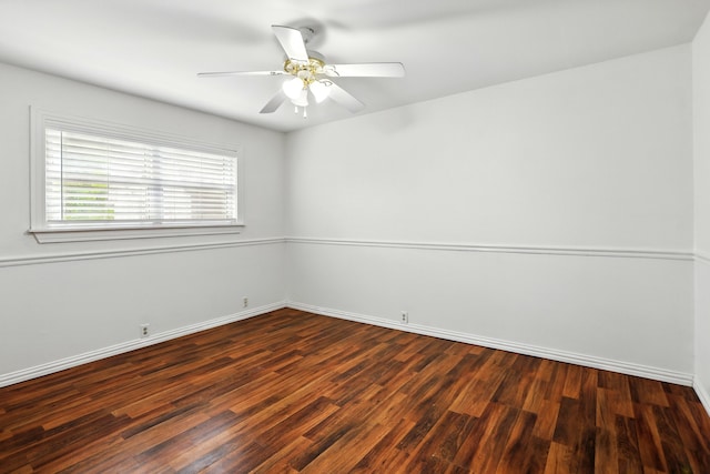 unfurnished room with baseboards, ceiling fan, and wood finished floors