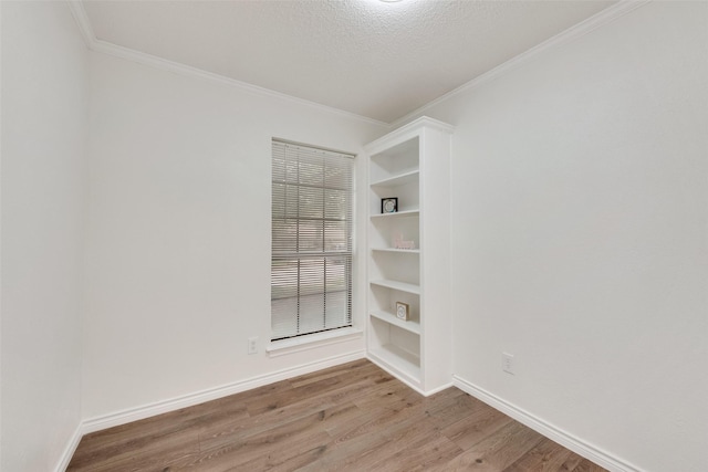 913 Vince Ln, Desoto, TX 75115 - unfurnished room featuring baseboards, ornamental molding, and wood finished floors