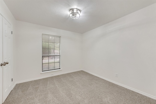 913 Vince Ln, Desoto, TX 75115 - spare room featuring baseboards, carpet flooring, and a textured ceiling