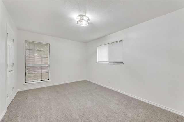 913 Vince Ln, Desoto, TX 75115 - carpeted empty room with a textured ceiling and baseboards