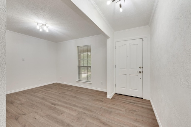 913 Vince Ln, Desoto, TX 75115 - foyer featuring a textured ceiling, ornamental molding, baseboards, and wood finished floors