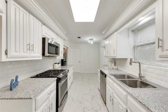 913 Vince Ln, Desoto, TX 75115 - kitchen featuring a sink, appliances with stainless steel finishes, white cabinetry, and marble finish floor