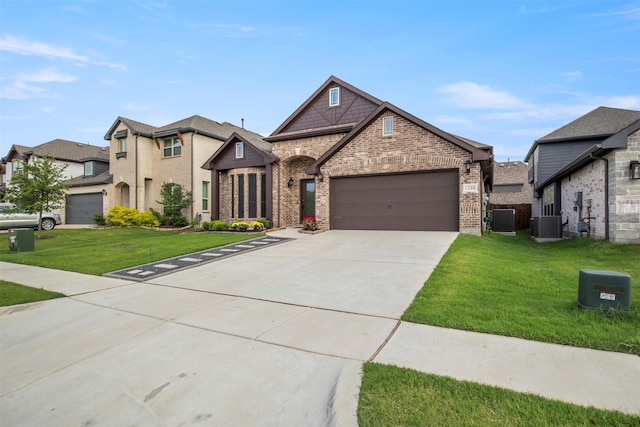 1248 Starlight Ave, Aubrey, TX 76227 - french provincial home with brick siding, a garage, a front lawn, and concrete driveway