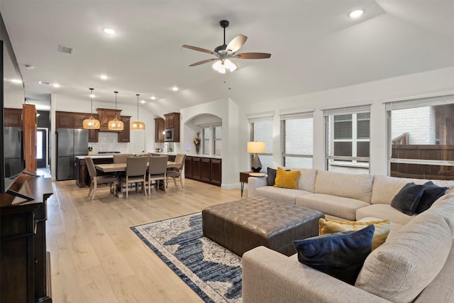 1248 Starlight Ave, Aubrey, TX 76227 - living room featuring lofted ceiling, a ceiling fan, light wood-style floors, and recessed lighting