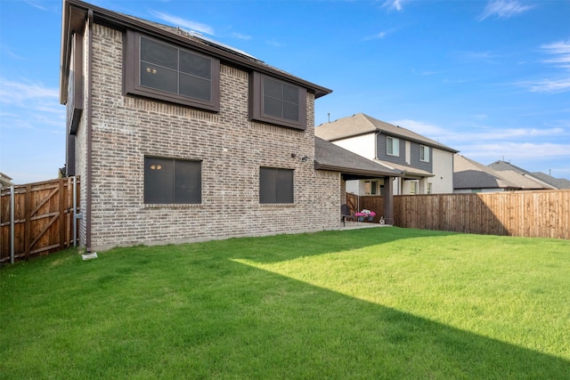 1248 Starlight Ave, Aubrey, TX 76227 - back of property featuring brick siding and a patio area