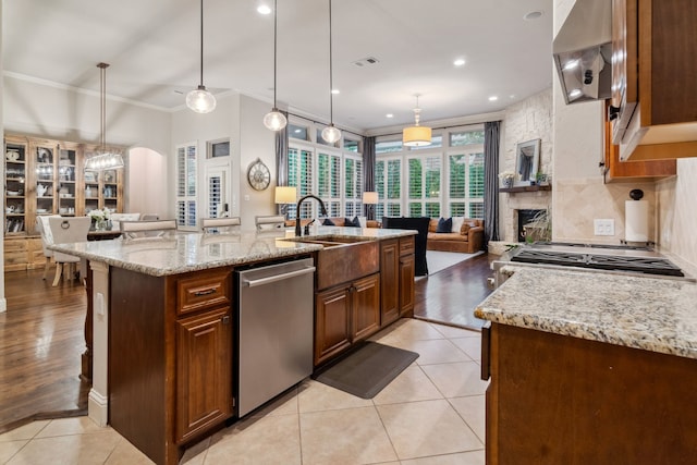 2206 Glasgow Dr, Trophy Club, TX 76262 - kitchen with stainless steel dishwasher, open floor plan, crown molding, ventilation hood, and an island with sink