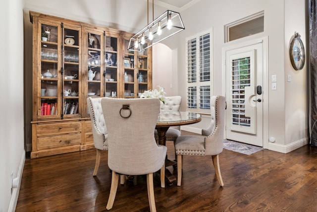 2206 Glasgow Dr, Trophy Club, TX 76262 - dining area featuring baseboards, dark wood finished floors, and crown molding