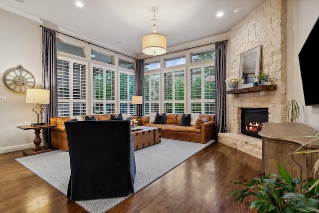 2206 Glasgow Dr, Trophy Club, TX 76262 - living area featuring ornamental molding, a stone fireplace, wood finished floors, baseboards, and recessed lighting