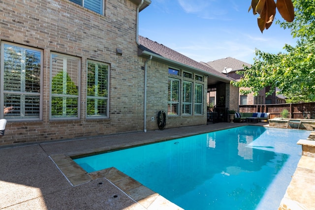 2206 Glasgow Dr, Trophy Club, TX 76262 - view of pool with a pool with connected hot tub, a patio area, and a fenced backyard