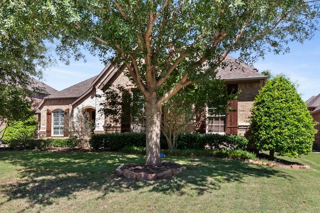 2206 Glasgow Dr, Trophy Club, TX 76262 - view of front facade featuring a front lawn, brick siding, and roof with shingles