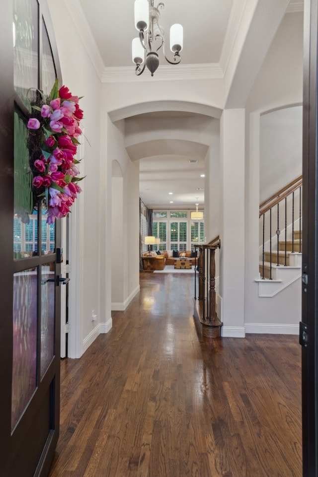 2206 Glasgow Dr, Trophy Club, TX 76262 - entryway featuring a chandelier, arched walkways, ornamental molding, baseboards, and wood finished floors