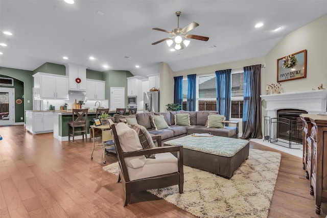 3213 Timberline Dr, Melissa, TX 75454 - living area with ceiling fan, visible vents, a fireplace, light wood-style floors, and recessed lighting