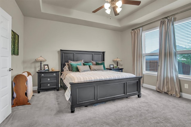3213 Timberline Dr, Melissa, TX 75454 - bedroom featuring a ceiling fan, a tray ceiling, light carpet, and baseboards