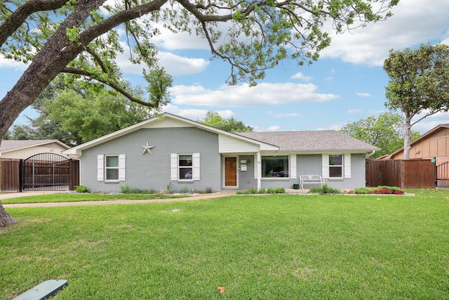 ranch-style house with fence, a gate, stucco siding, and a front lawn