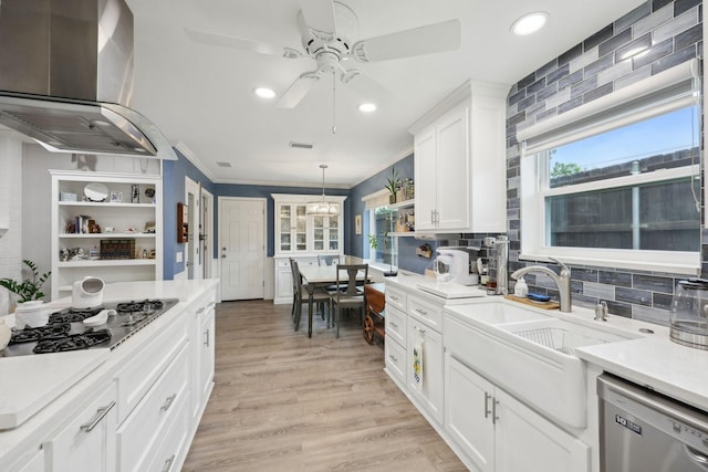 kitchen with stainless steel dishwasher, open shelves, ceiling fan, wall chimney range hood, and gas cooktop