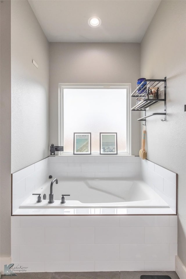 full bathroom with a bath