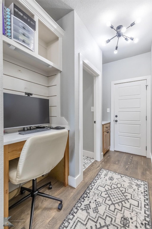 office featuring baseboards and wood finished floors