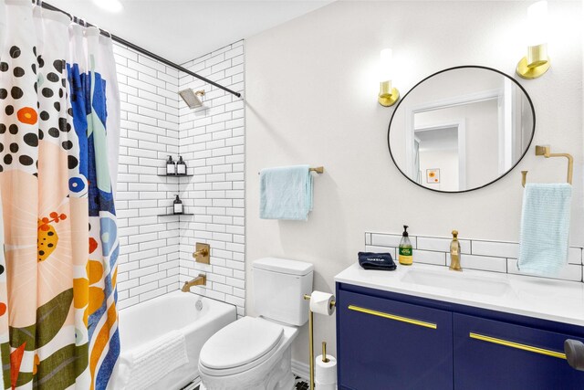 full bathroom featuring vanity, toilet, and shower / bath combo with shower curtain