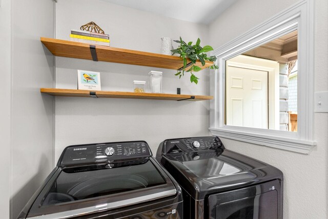 washroom featuring laundry area and washer and dryer