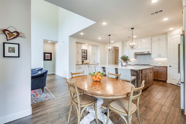 13845 Marys Ridge Rd, Fort Worth, TX 76008 - dining room with a notable chandelier, dark wood finished floors, recessed lighting, baseboards, and visible vents