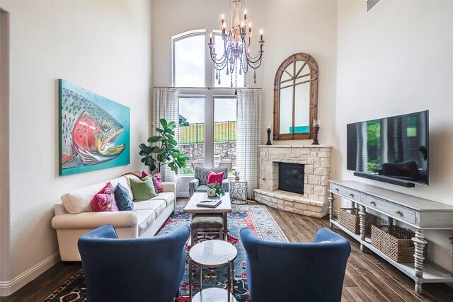13845 Marys Ridge Rd, Fort Worth, TX 76008 - living room with a chandelier, a stone fireplace, a towering ceiling, visible vents, and dark wood-style floors