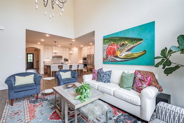 13845 Marys Ridge Rd, Fort Worth, TX 76008 - living room with wood finished floors, baseboards, recessed lighting, a chandelier, and arched walkways