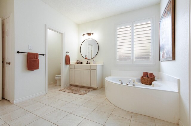 full bathroom with vanity, tile patterned floors, a garden tub, and toilet