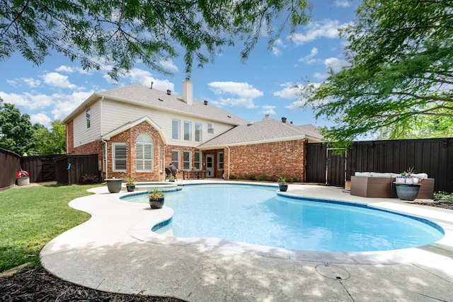 view of swimming pool with a lawn, a fenced in pool, a fenced backyard, and a patio area