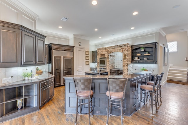 kitchen with ornamental molding, open shelves, and backsplash