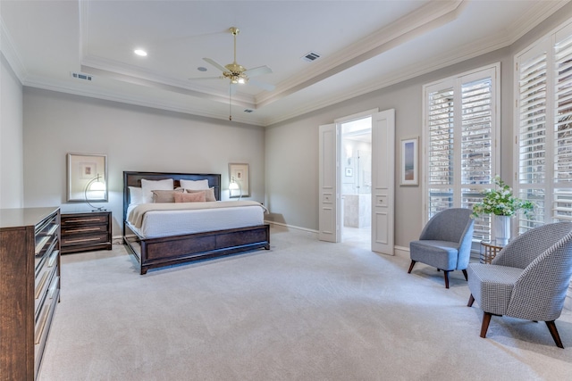 bedroom featuring a raised ceiling, ornamental molding, light carpet, and visible vents