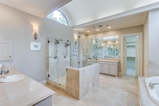 bathroom with a bath, a shower stall, two vanities, a sink, and ornamental molding