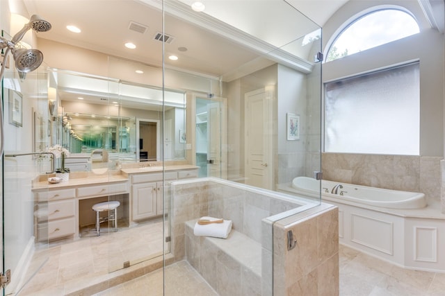 bathroom featuring an enclosed shower, visible vents, a garden tub, and vanity