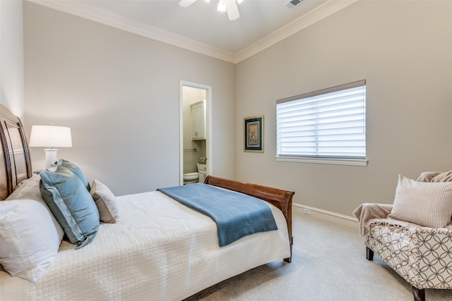 carpeted bedroom with a ceiling fan, visible vents, baseboards, connected bathroom, and ornamental molding