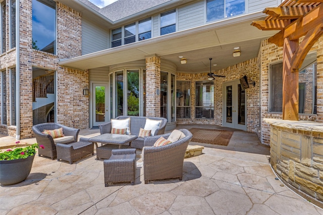 view of patio with a ceiling fan, outdoor lounge area, and french doors