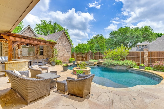 view of pool featuring a fenced backyard, a ceiling fan, a patio, and exterior kitchen