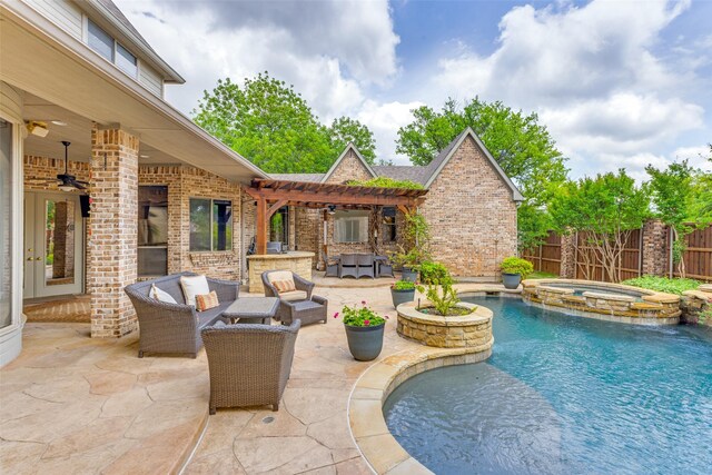 view of pool featuring ceiling fan, an outdoor living space, a pool with connected hot tub, a patio area, and fence